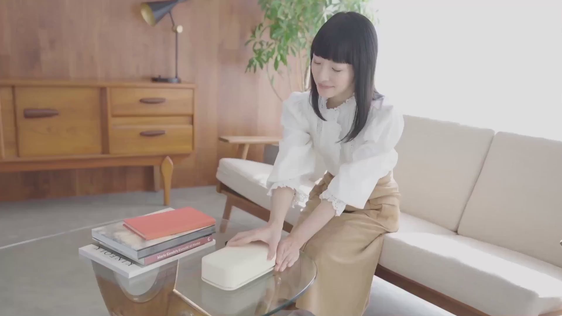 Marie Kondo demonstrates the Stolp x KonMari phone box as part of a daily digital-declutter ritual
